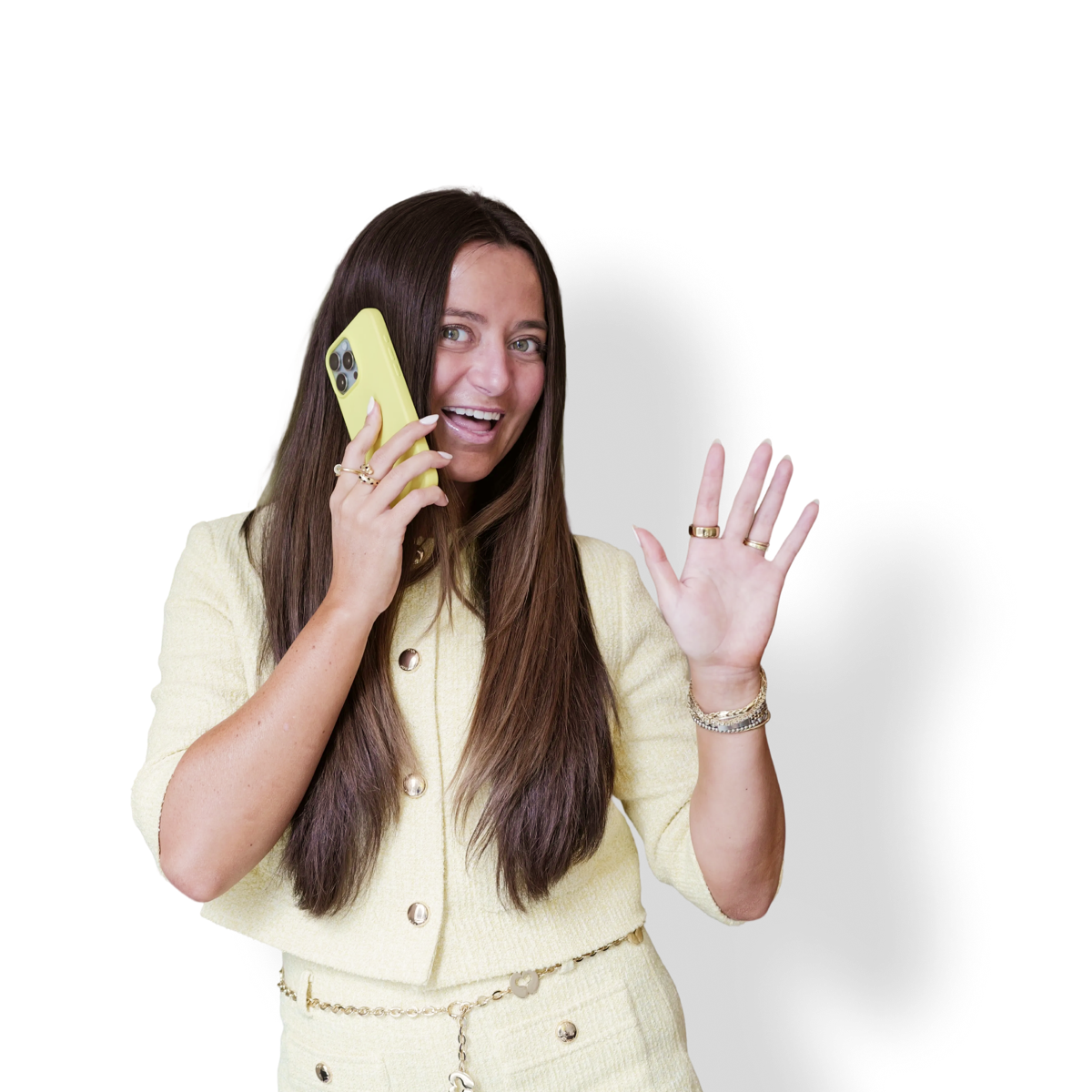 Sara Uy waving with a yellow phone in hand